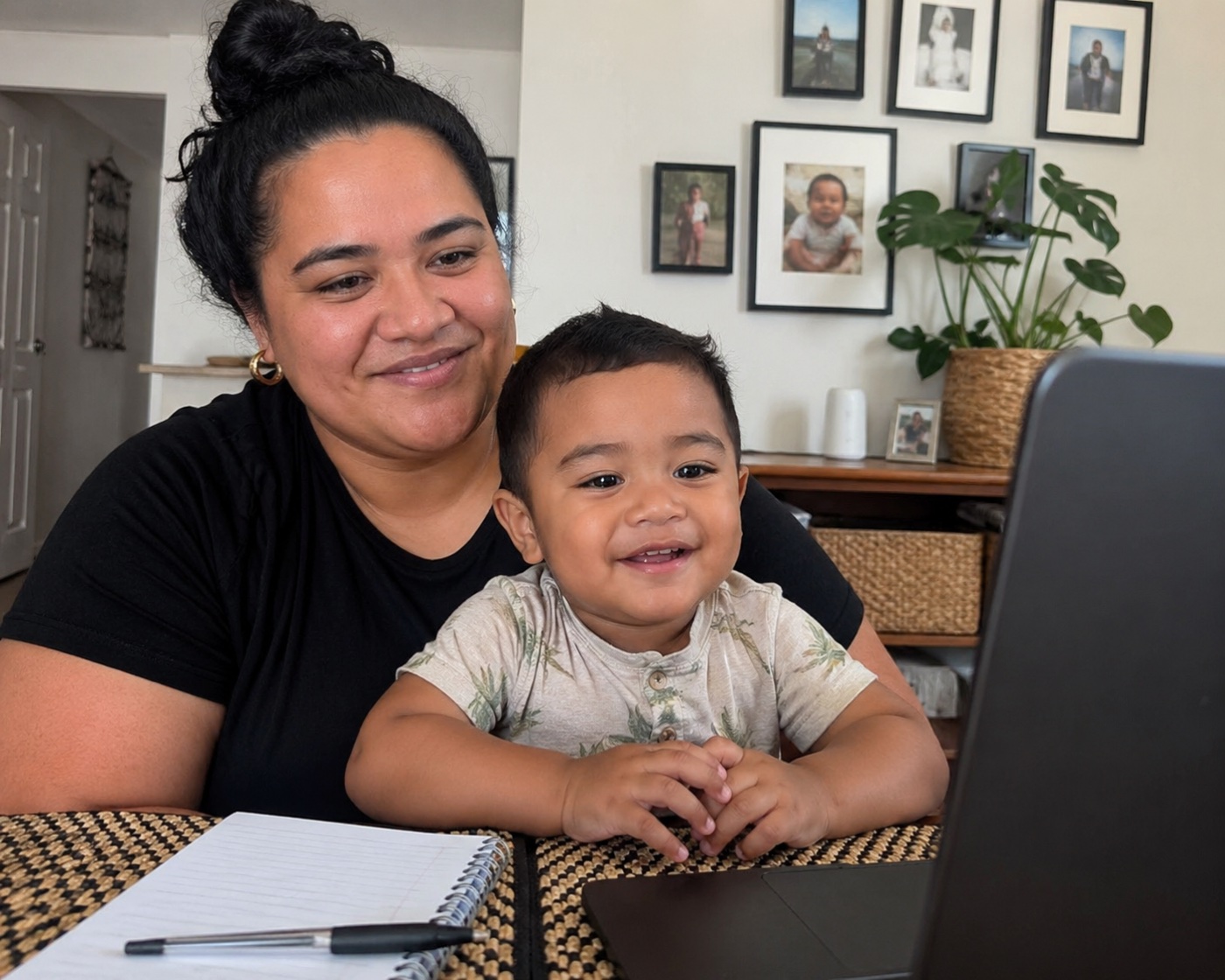A Pasifika mother and her young son on a video call from home